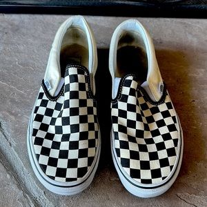 Black and white checkered Vans slip-ons. Size 6.5.